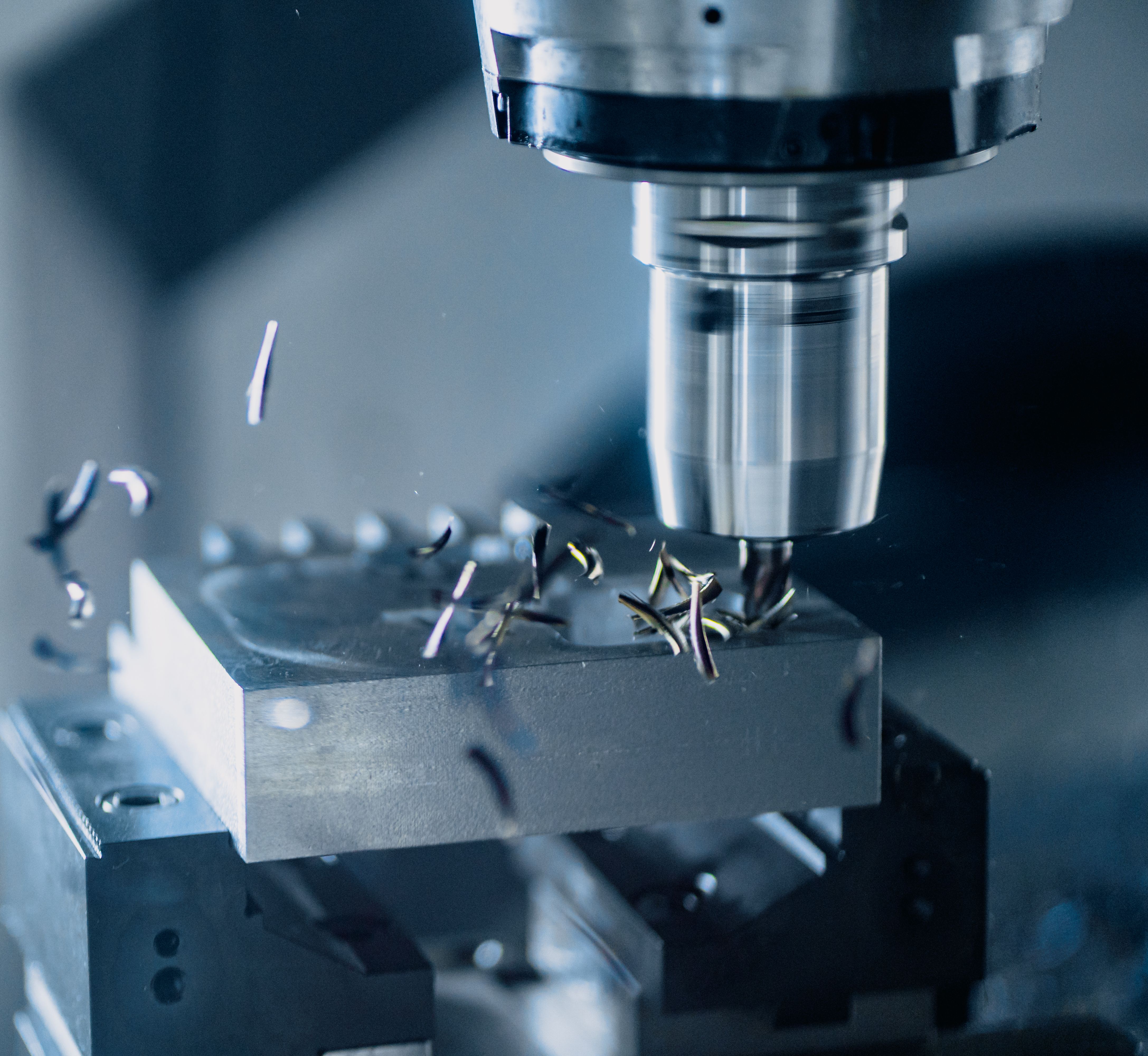 CNC milling machine producing a precision metal component
